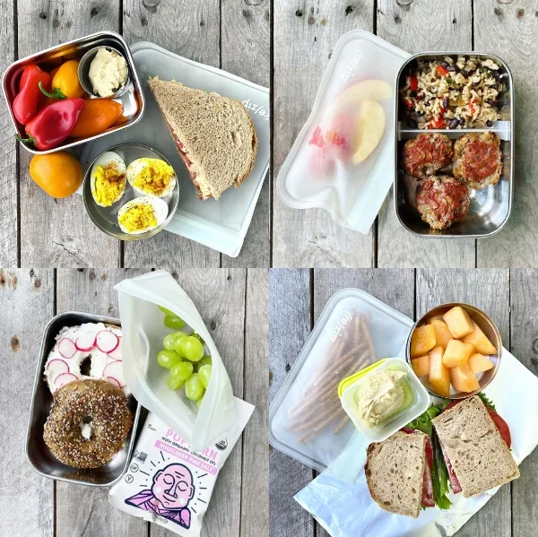 Variety of healthy lunch boxes with sandwiches and fresh fruits