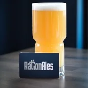 Craft beer in a glass with a branded card