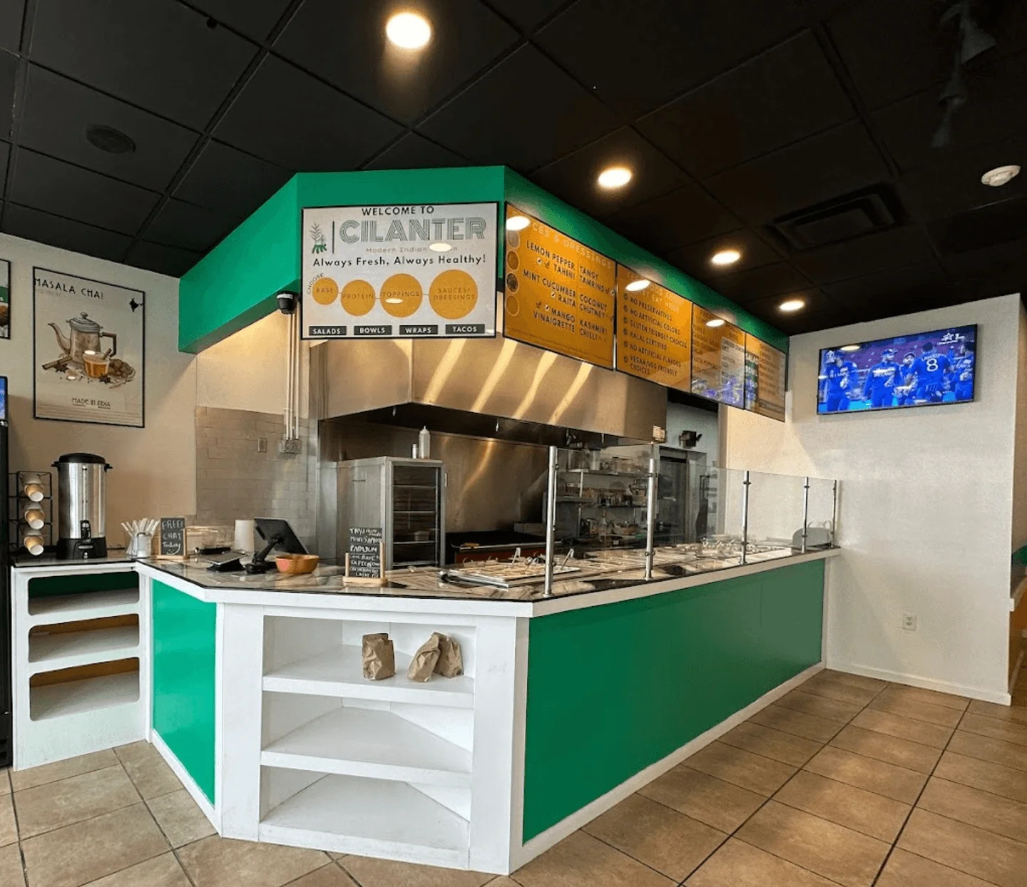 Modern restaurant interior with vibrant decor and open kitchen