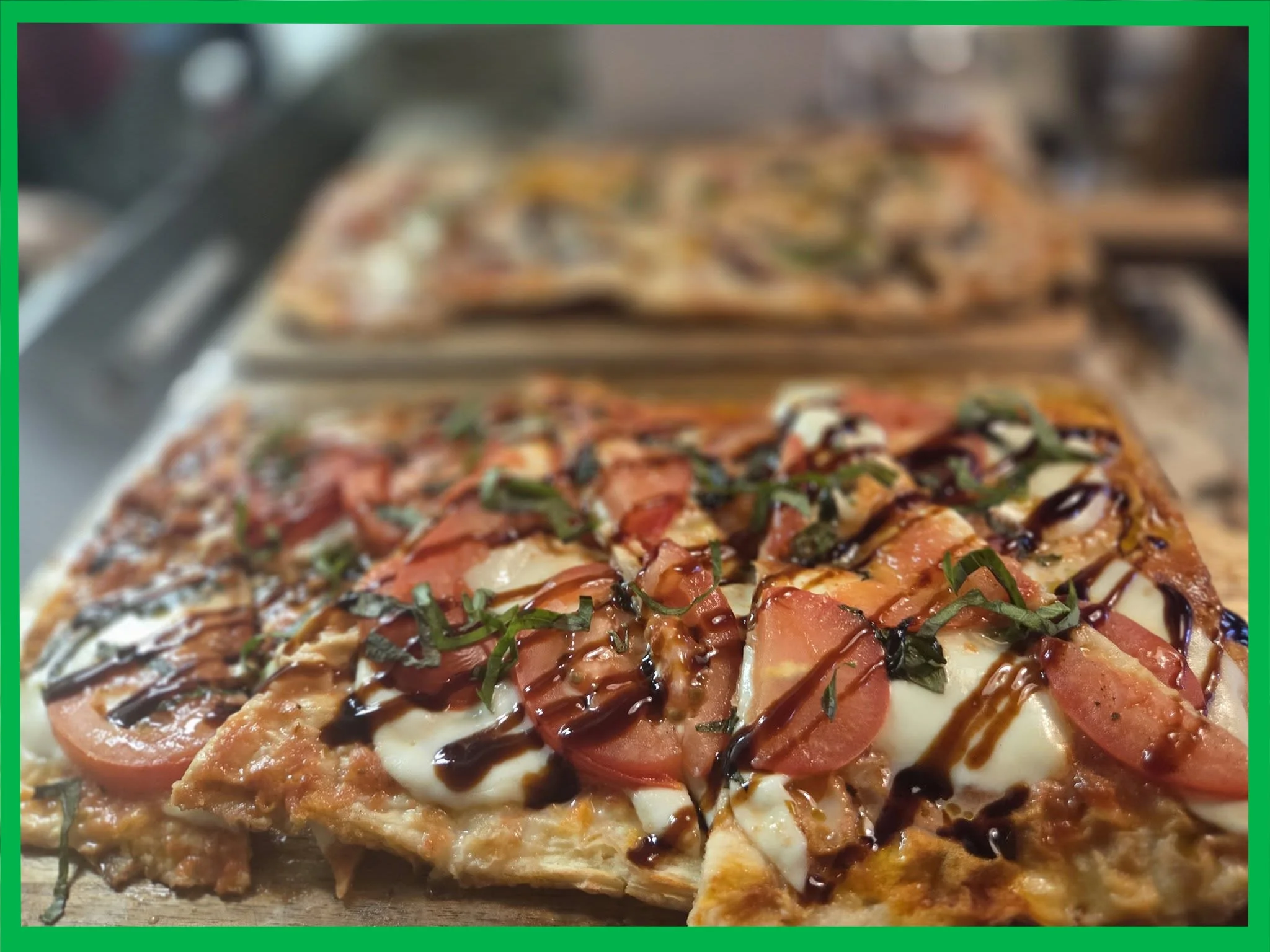 Gourmet flatbread pizza with fresh tomatoes and basil