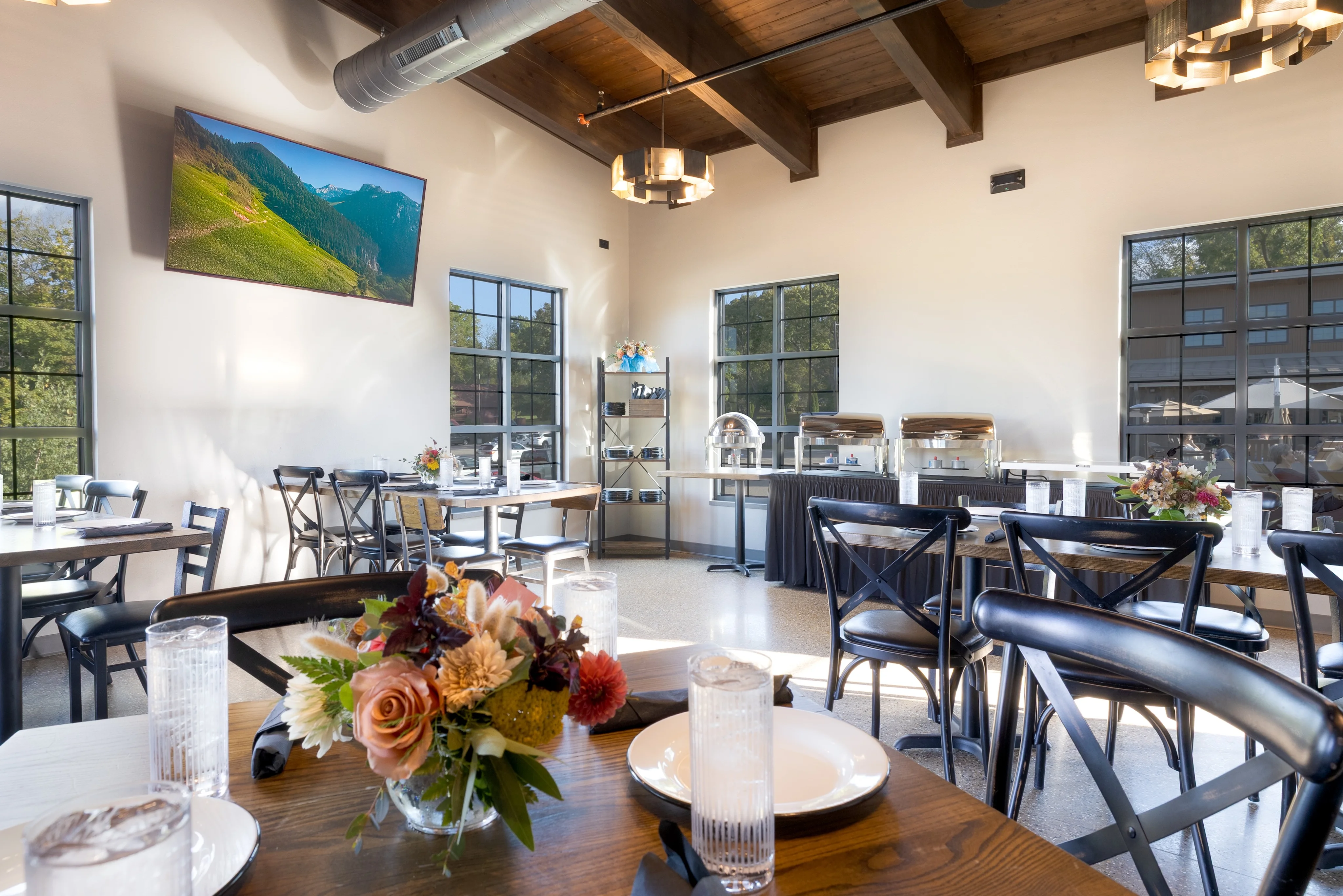 Modern restaurant interior with wooden beams and elegant decor