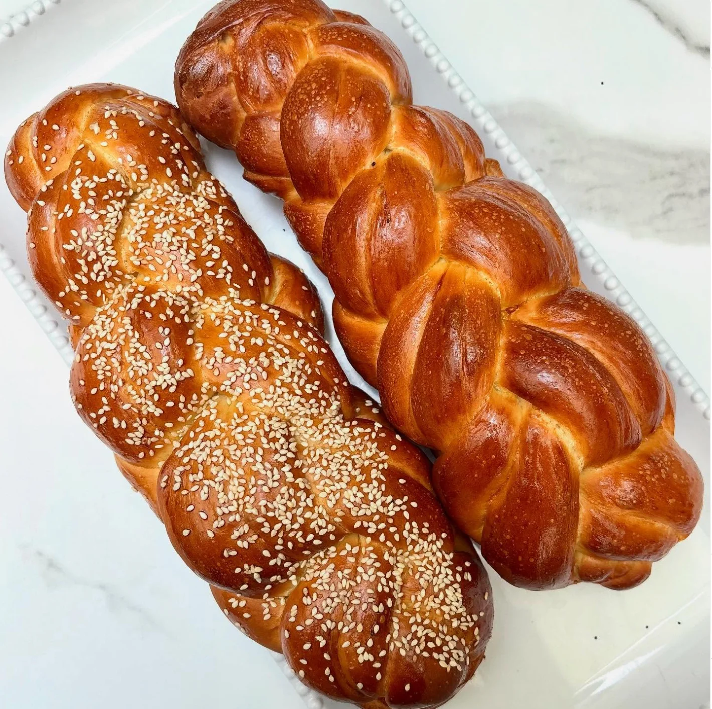 Freshly baked challah bread with sesame seeds