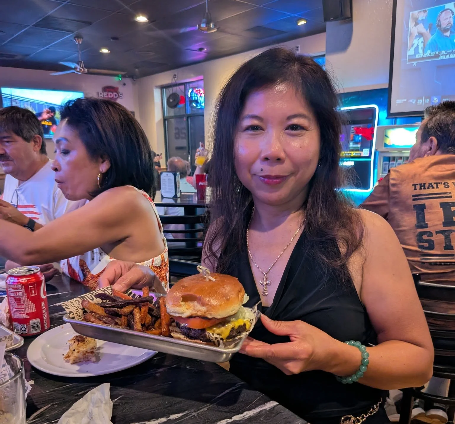 Delicious gourmet burger with fresh toppings on a wooden table