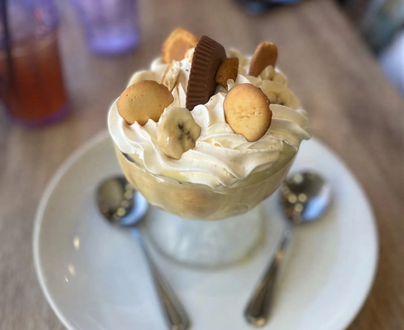 Banana pudding dessert topped with whipped cream