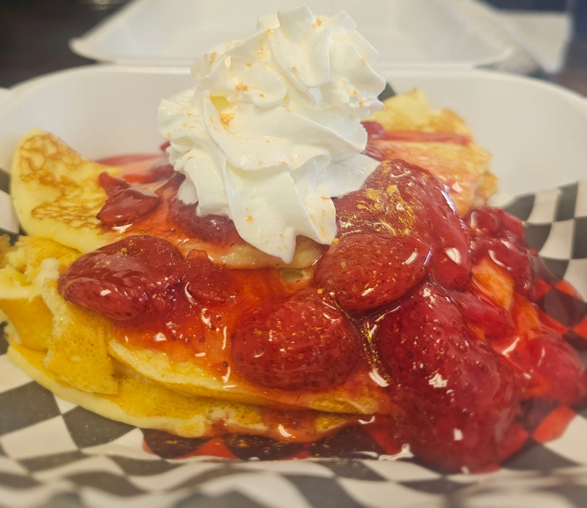 Delicious strawberry shortcake pancakes with whipped cream