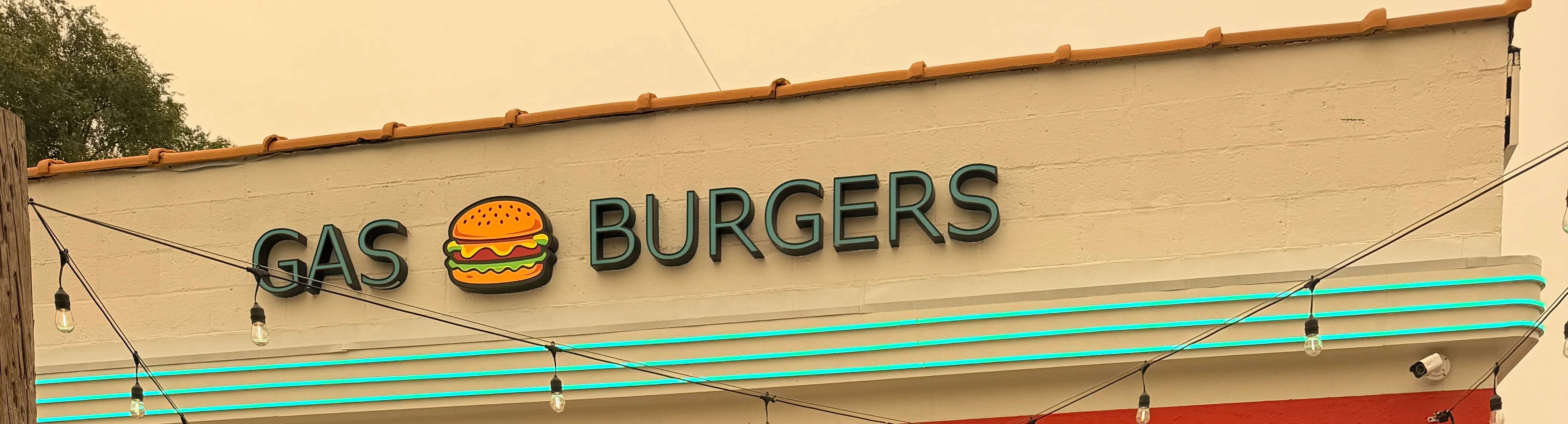 Exterior of Gas Burgers restaurant with neon signage