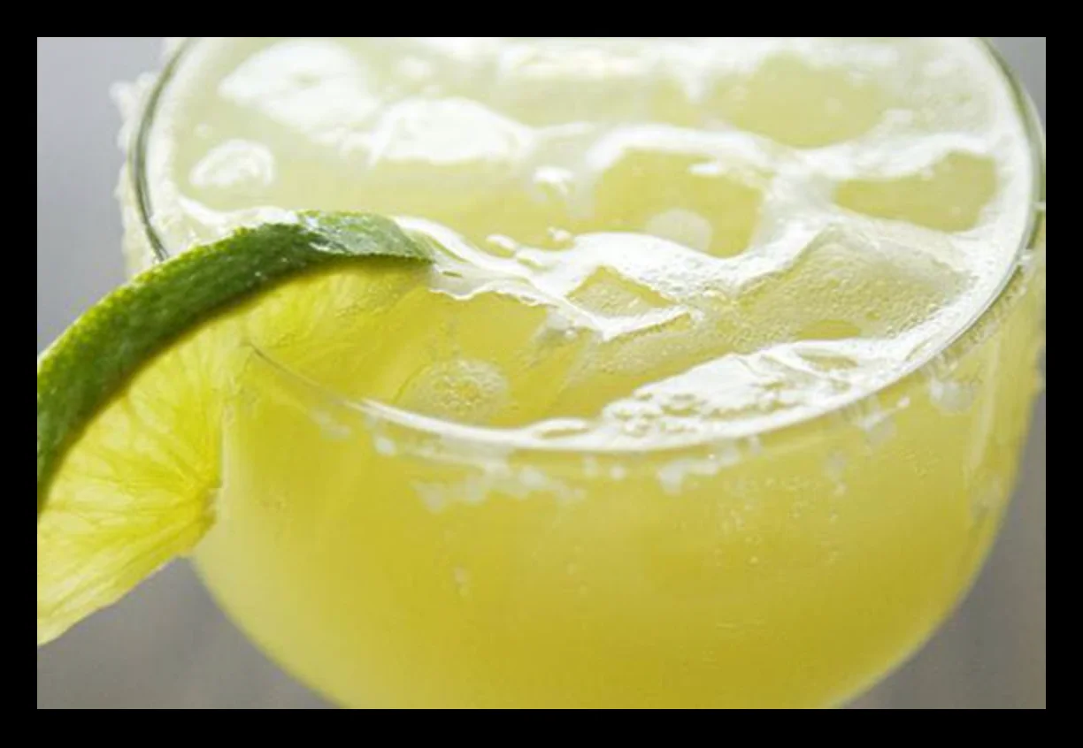 Refreshing margarita cocktail with lime garnish