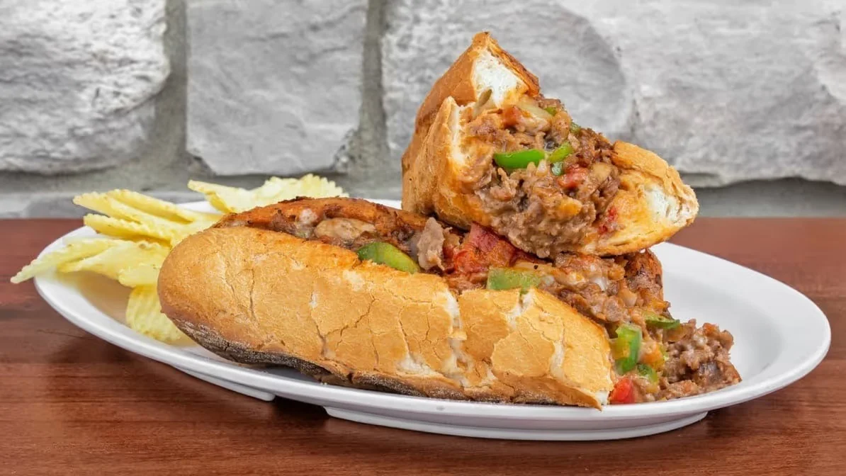 Delicious gourmet burger with fresh toppings on a wooden table