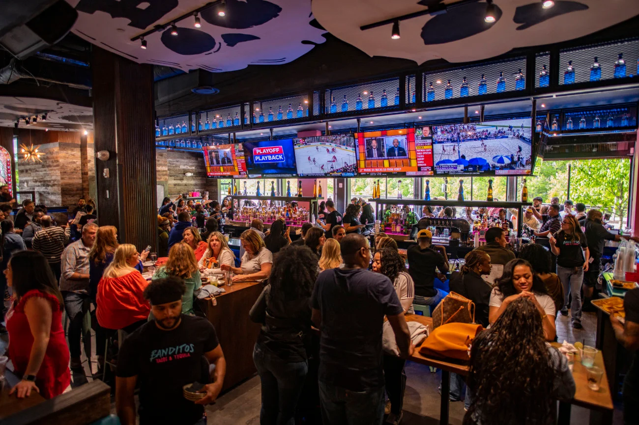 Interior view of a vibrant restaurant with colorful decor and seating.