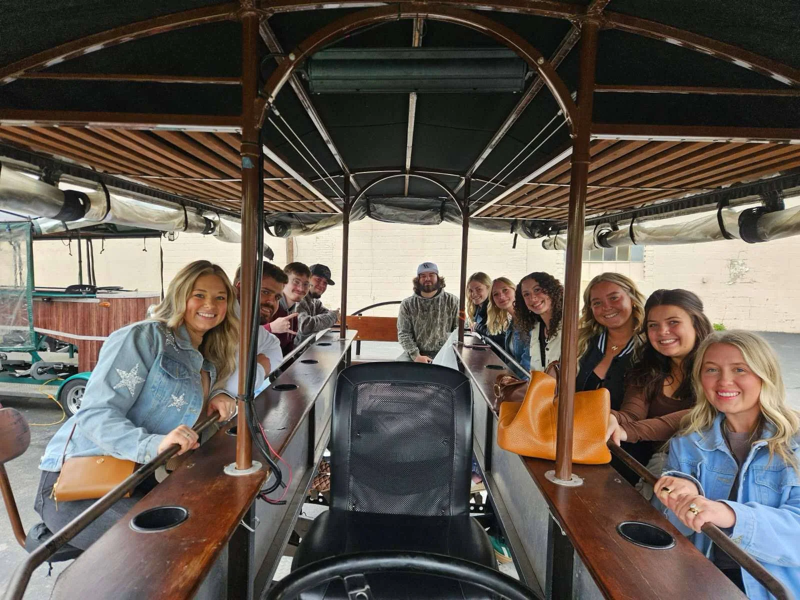Group of friends enjoying a fun outing on a unique transport vehicle