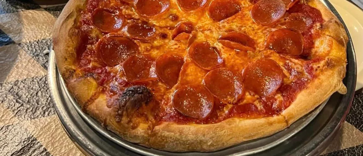 Pepperoni pizza served in a restaurant