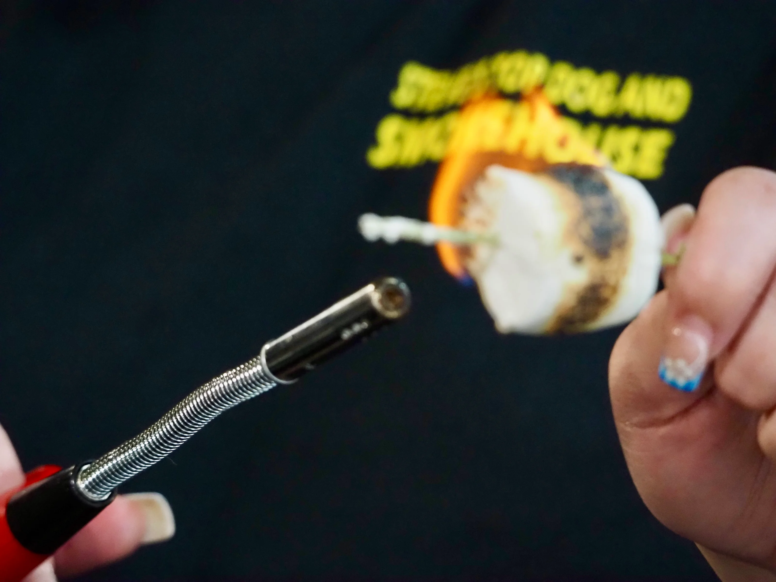 Chef using a torch to caramelize a dessert marshmallow