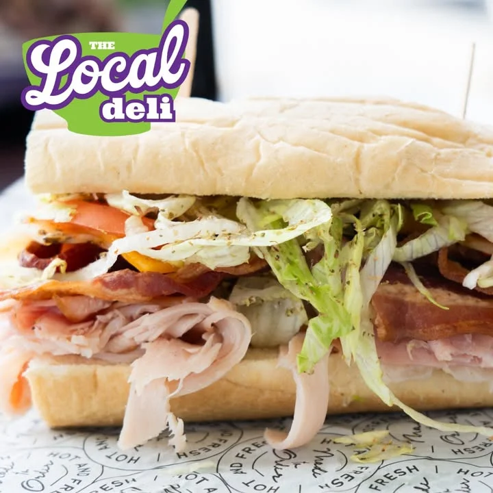 Classic deli sandwich with layers of meats and fresh vegetables