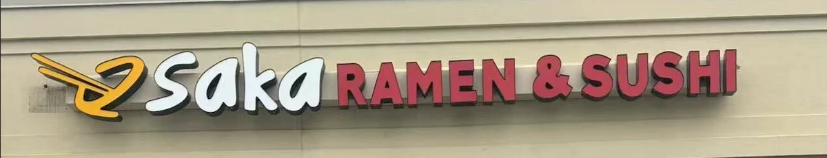 Saka Ramen & Sushi restaurant sign featuring vibrant lettering