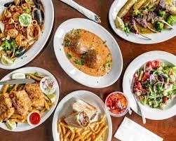 Assorted Mediterranean dishes including seafood and grilled meats