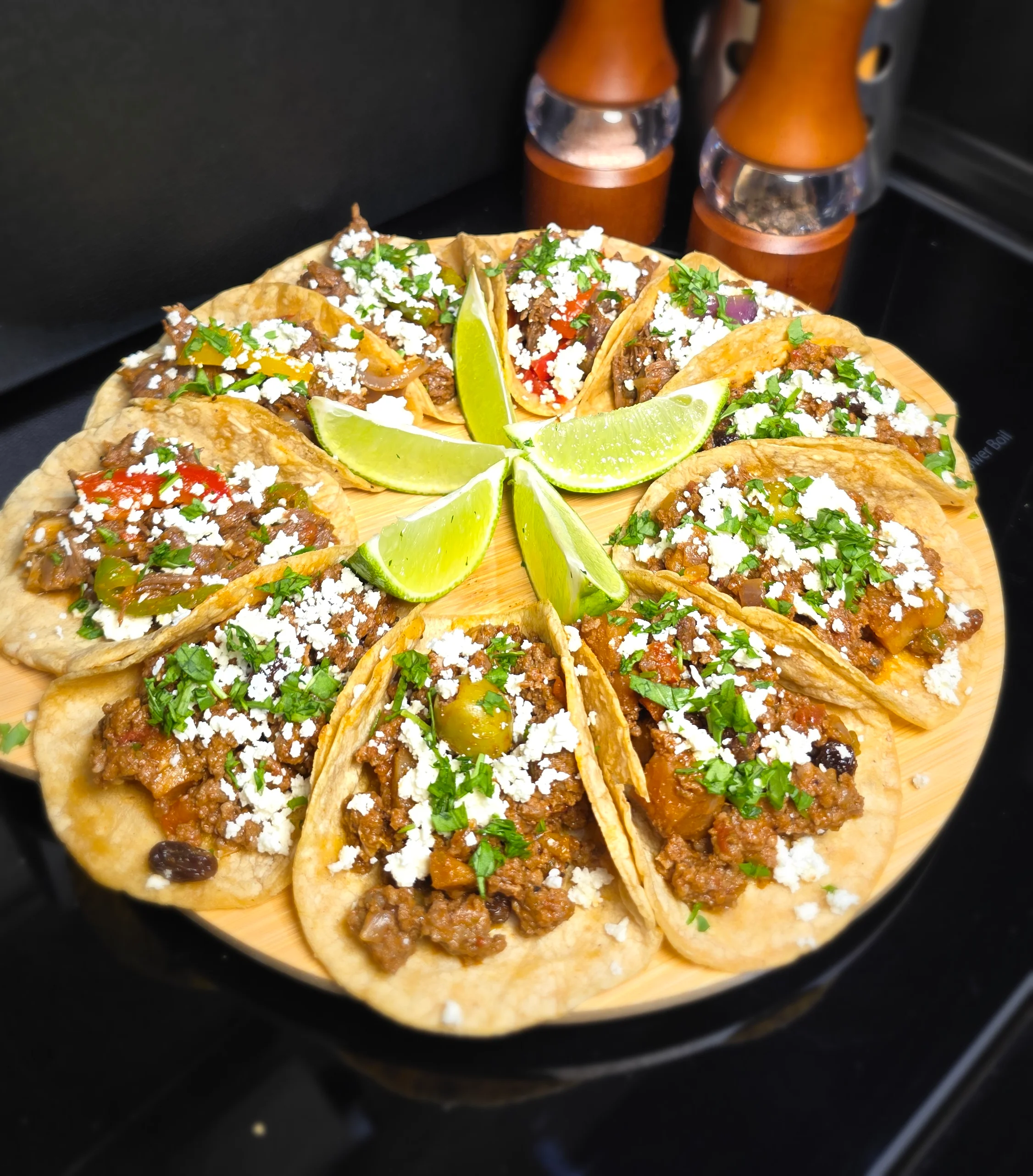 Delicious Mexican street tacos garnished with lime and cilantro