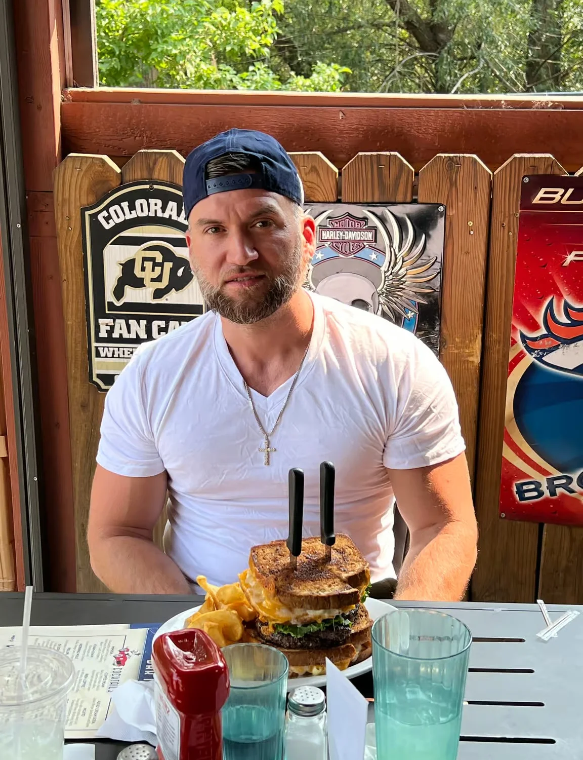 Giant grilled cheese sandwich with fries at a casual restaurant