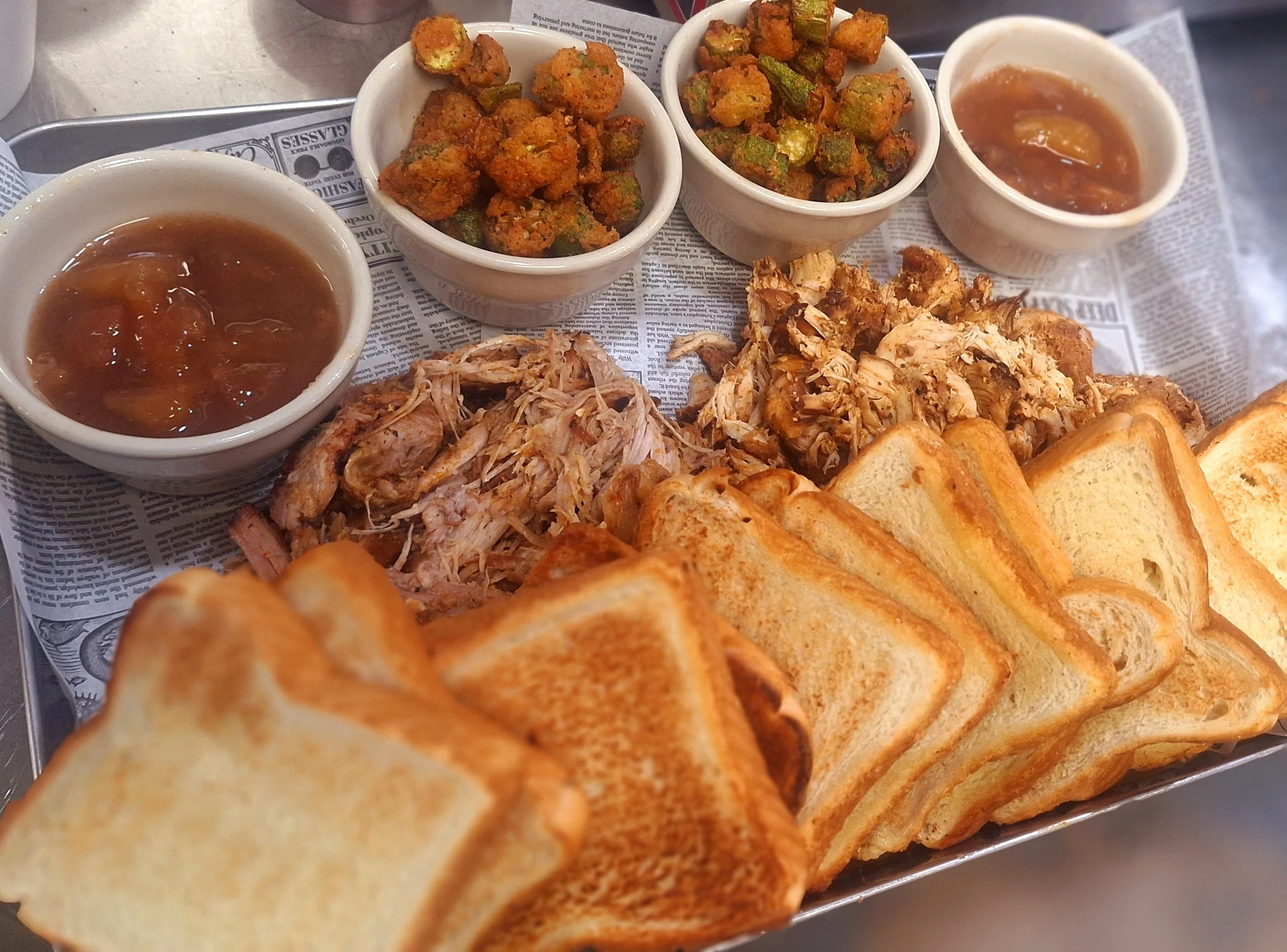 Southern pulled pork platter with toast and sides