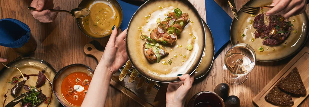 A beautifully arranged table with delicious dishes and drinks.