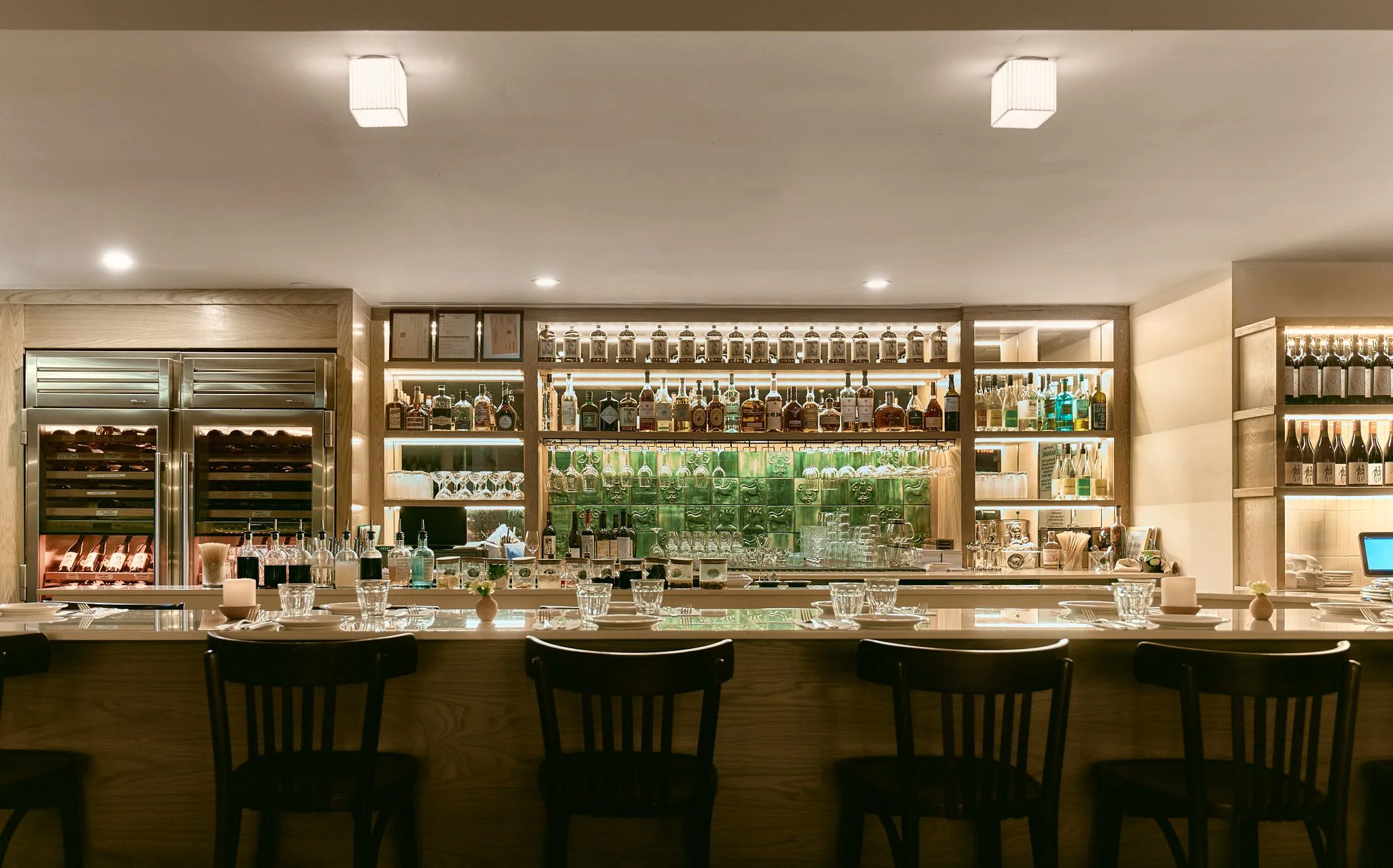 Modern bar interior with a well-stocked liquor display