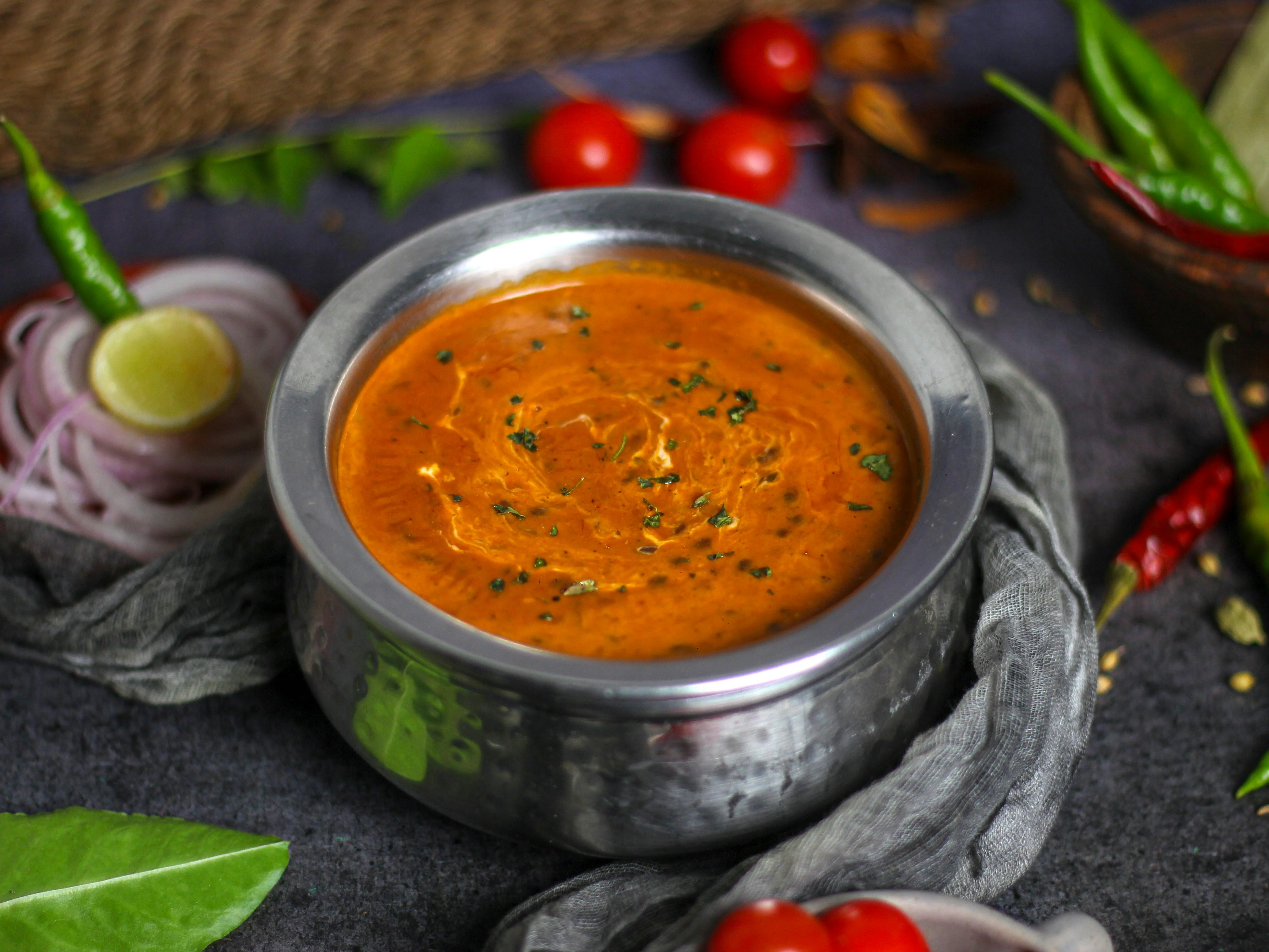 Rich Indian butter chicken curry in a traditional bowl