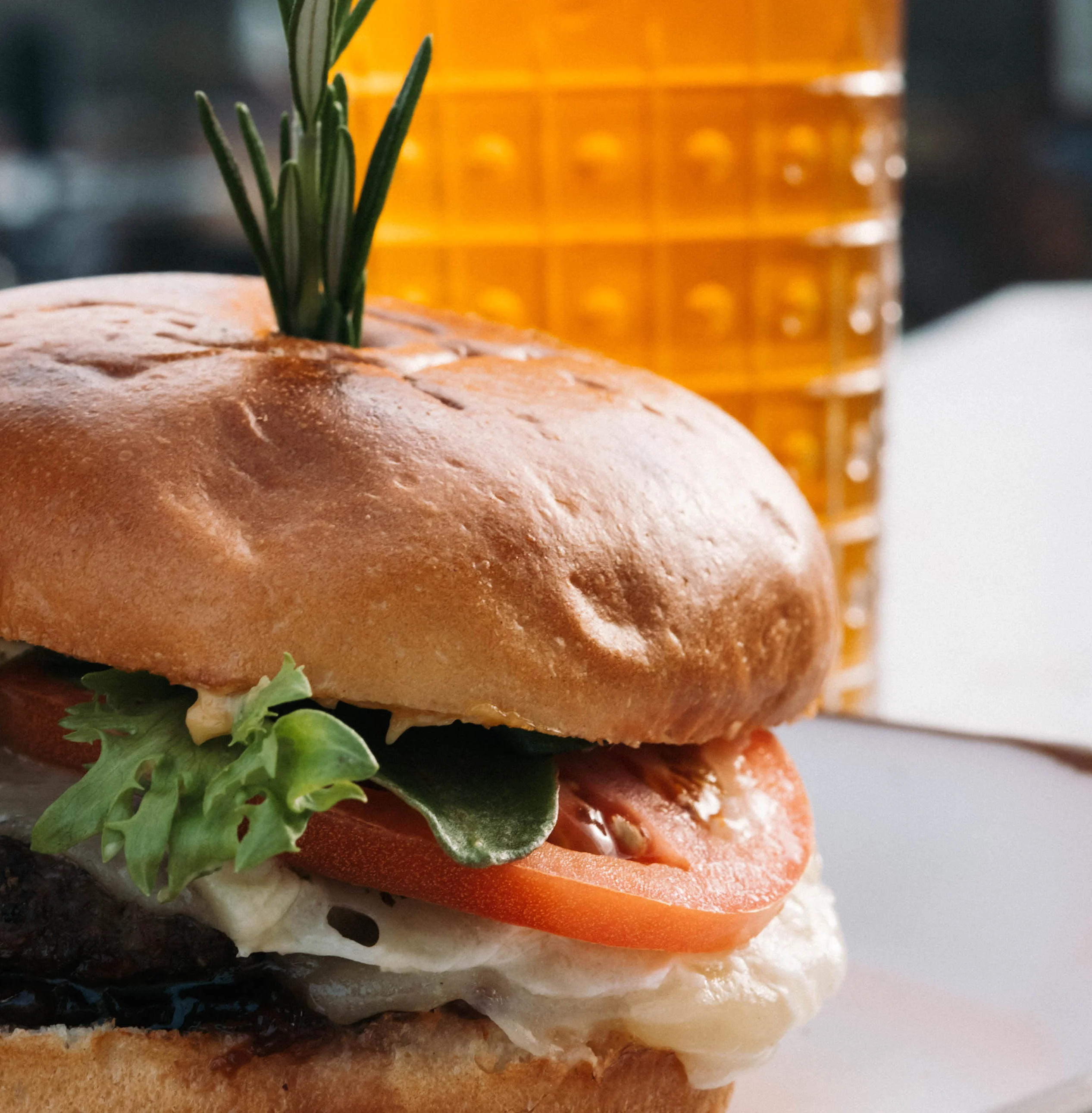 Juicy gourmet burger with fries and craft beer