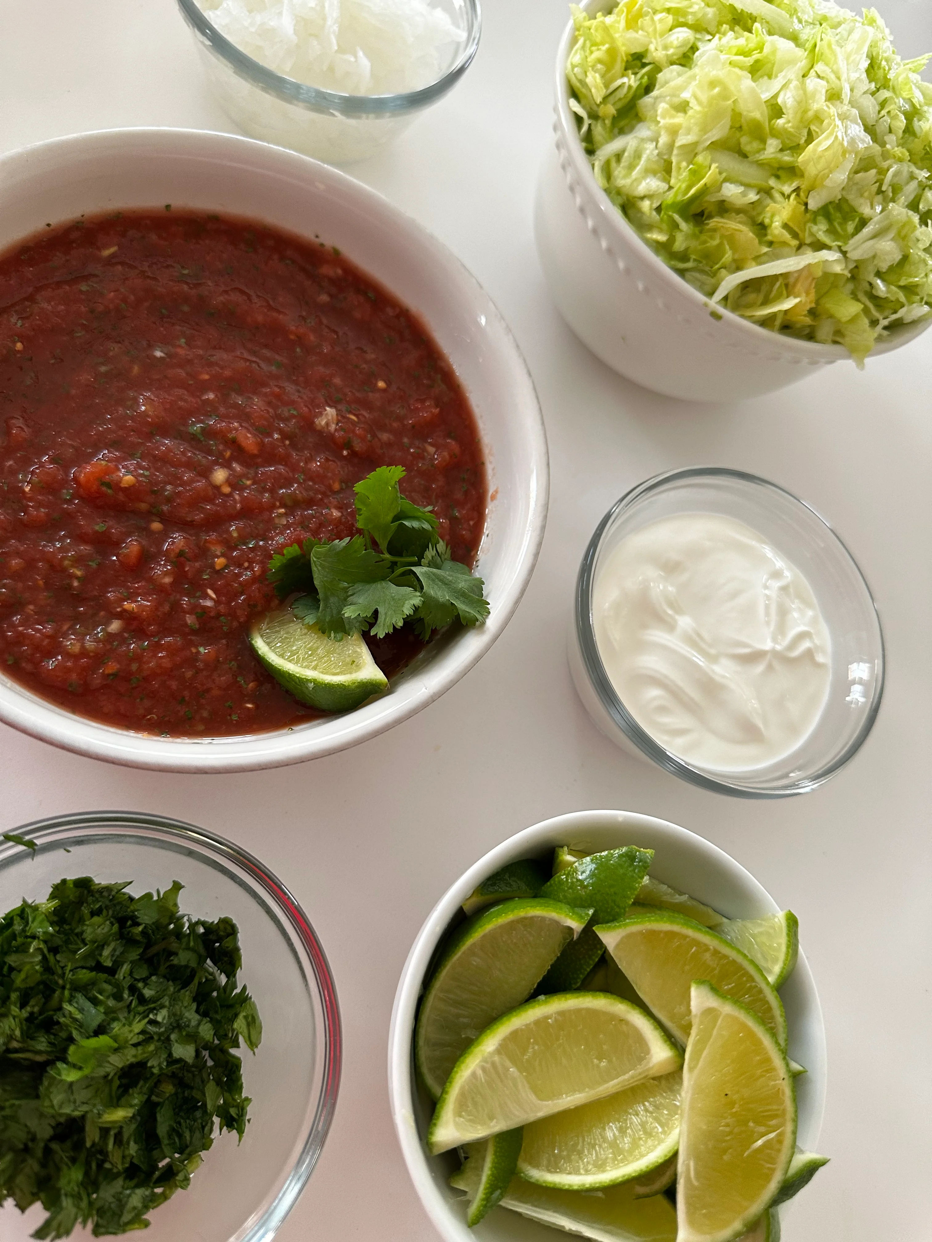 Fresh salsa with lime and toppings for Mexican cuisine
