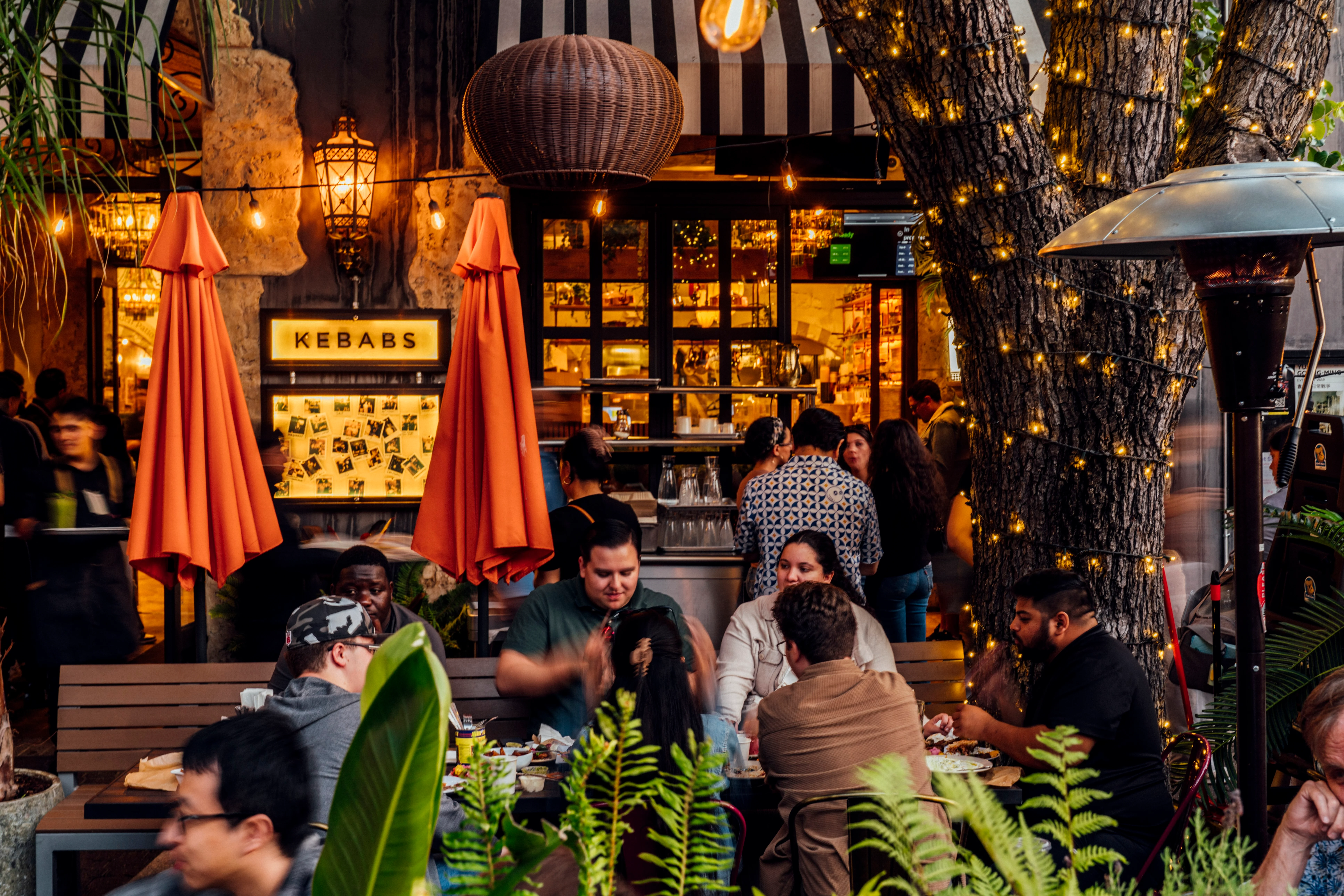 A busy night on the front patio of Mazra - Redwood City