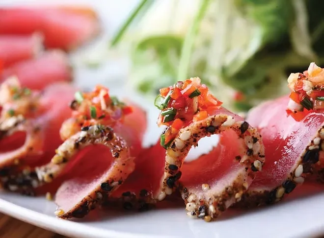 Seared tuna tataki with vibrant garnish
