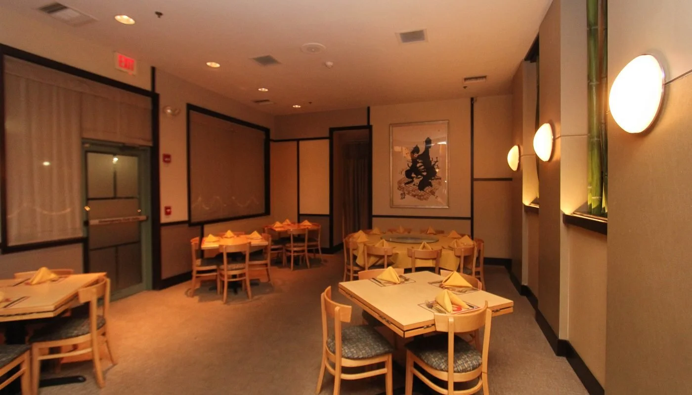 Cozy restaurant interior with warm lighting and wooden tables