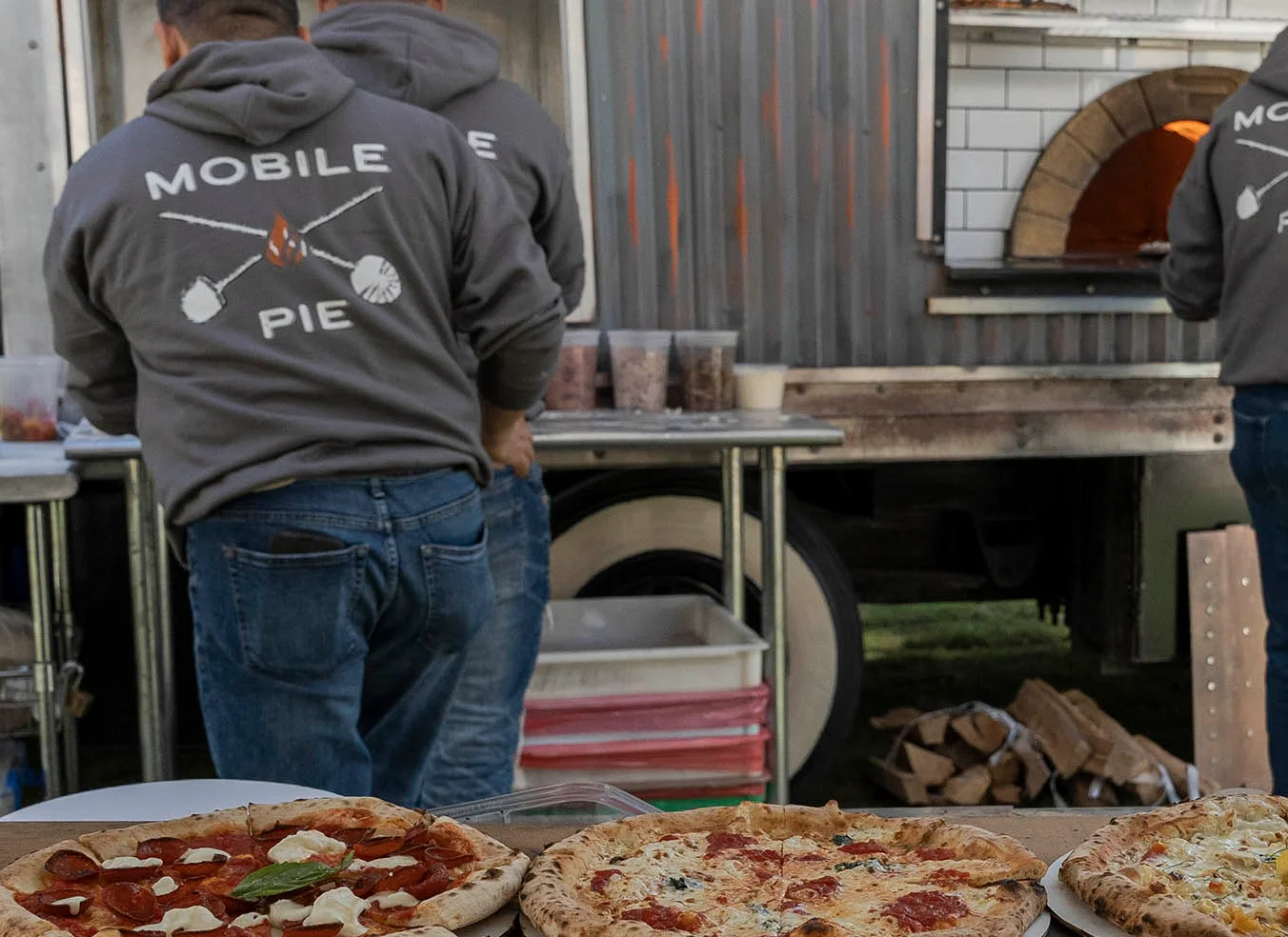 Exit 4 Food Hall wood-fired pizza truck at an outdoor event in Westchester County