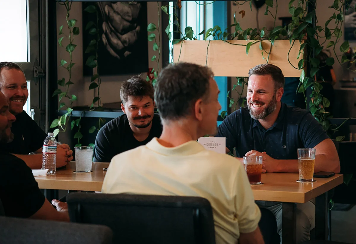 Photo of people eating at a Common Table