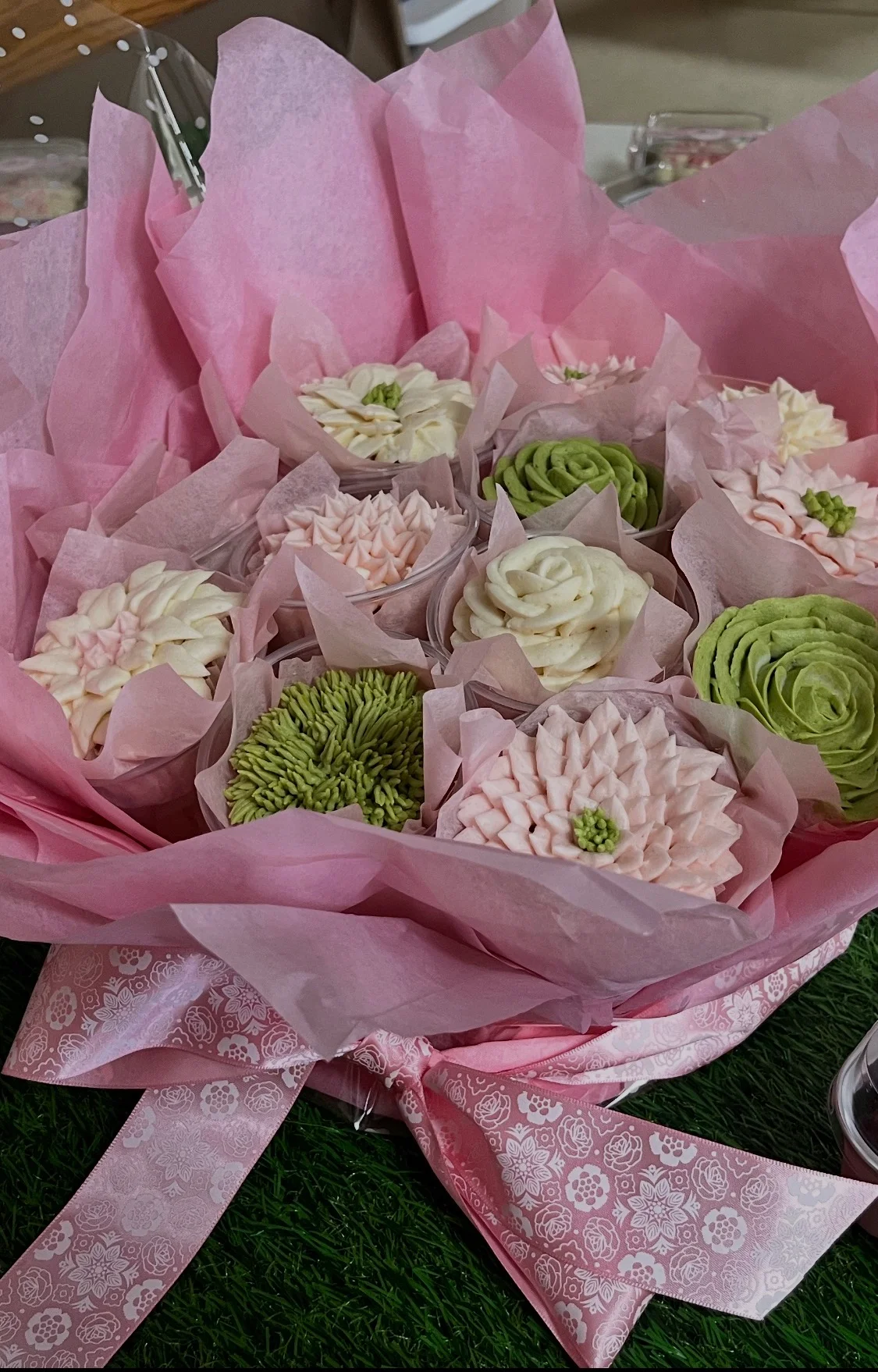 Beautiful floral cupcake bouquet in pink wrapping