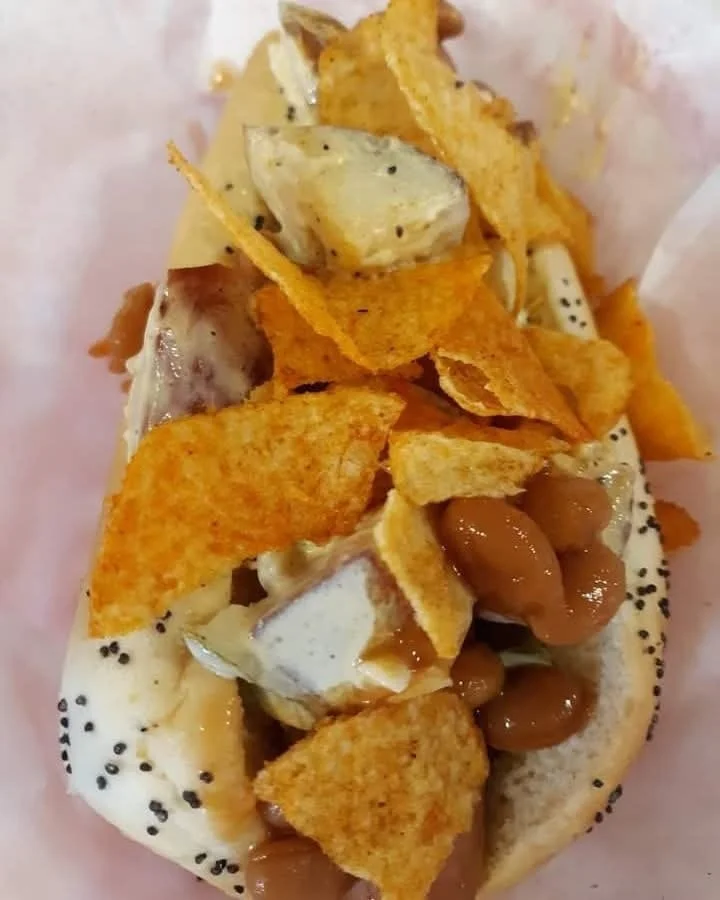 Unique Chicago-style hot dog topped with beans and chips