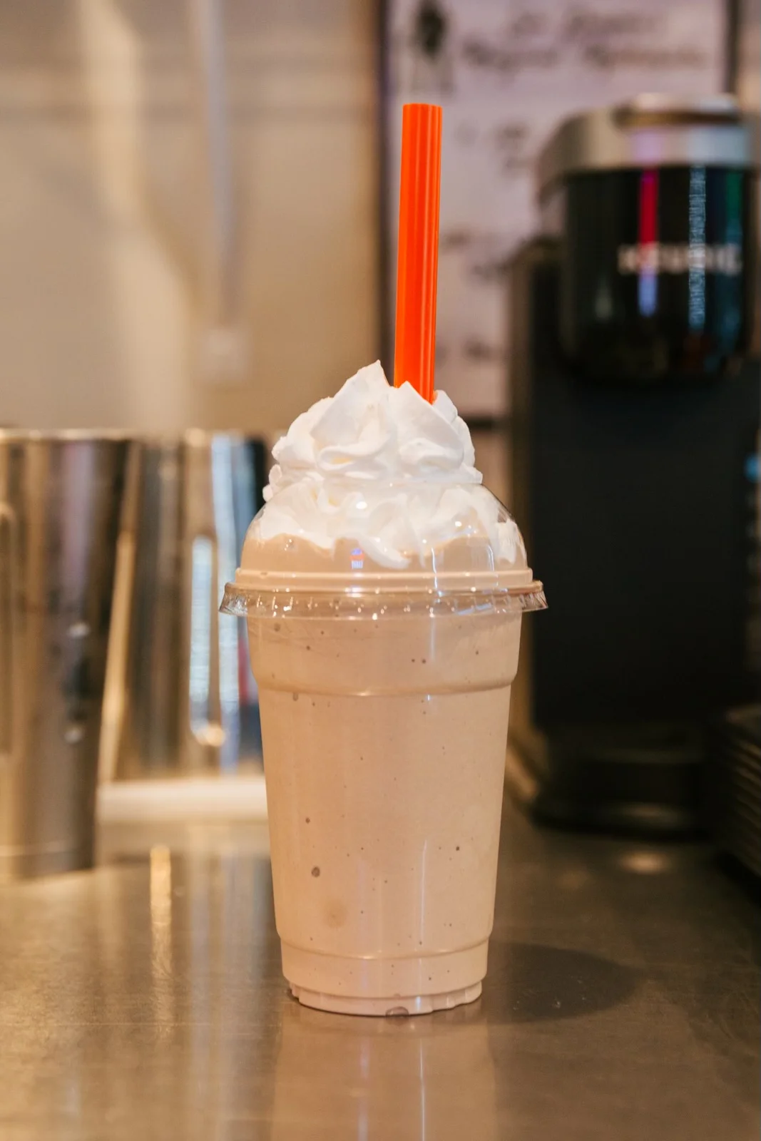 Delicious chocolate shake topped with whipped cream and chocolate drizzle