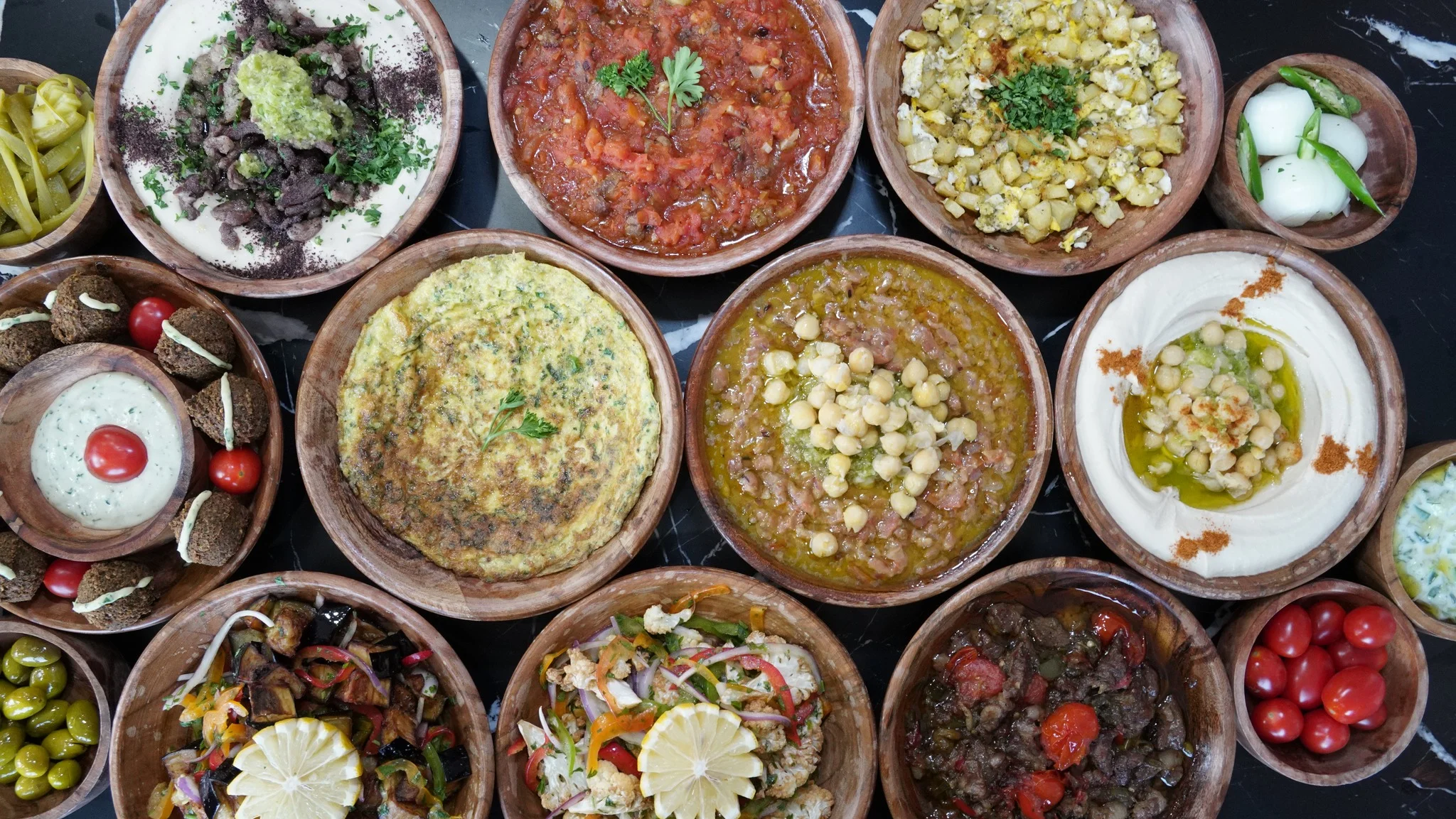 Assorted Middle Eastern mezze platter with dips and salads