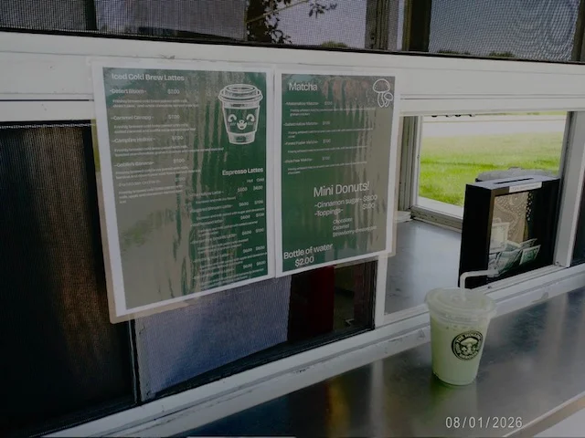Menu board featuring iced lattes and matcha drinks