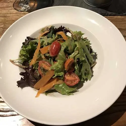 Large white bowl with salad