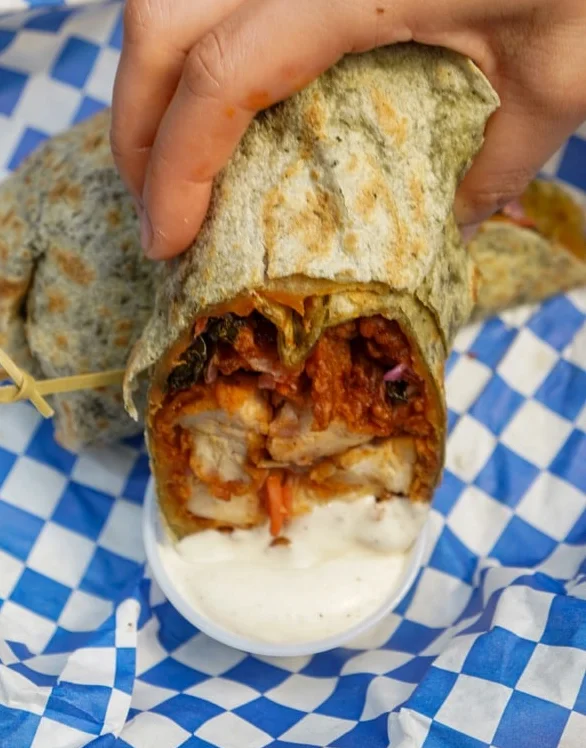 Delicious burrito wrapped in blue checkered paper