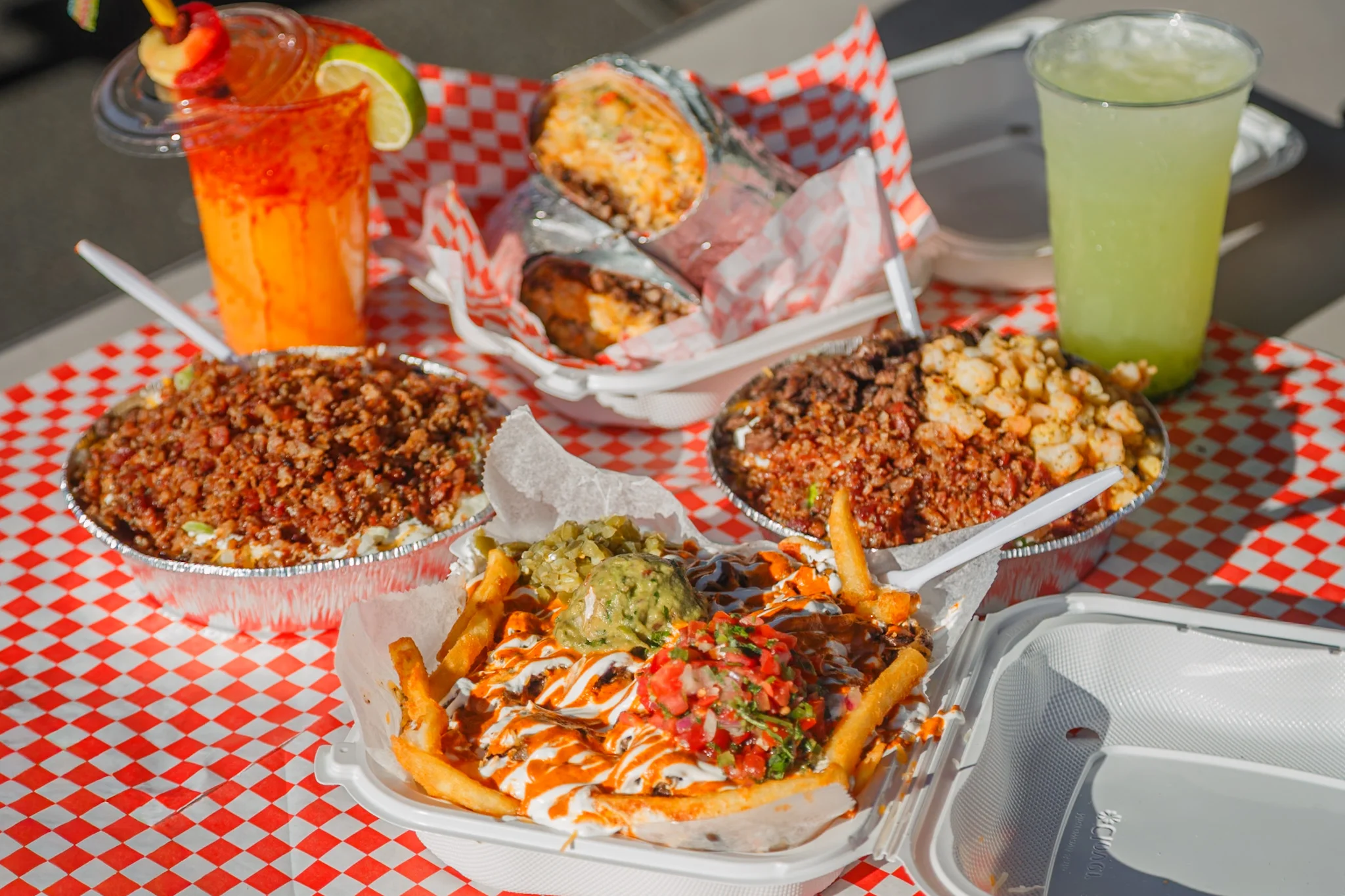 Delicious gourmet burger with fresh toppings on a wooden table.
