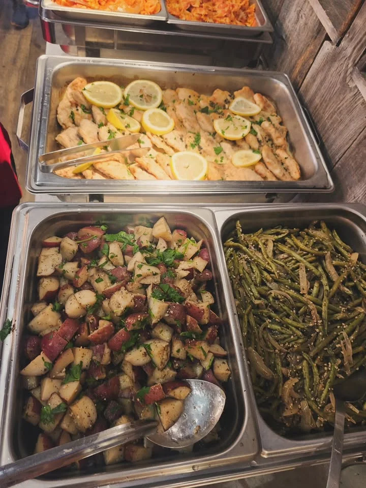 Grilled fish with lemon and herbs, served with sides