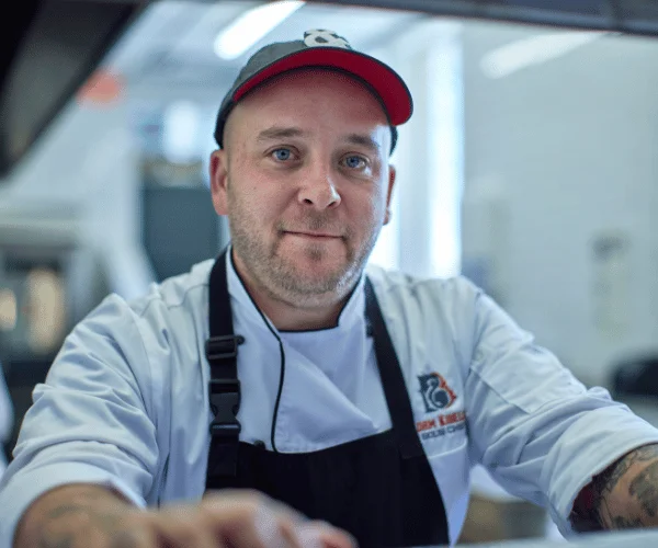 Chef in a modern kitchen preparing dishes