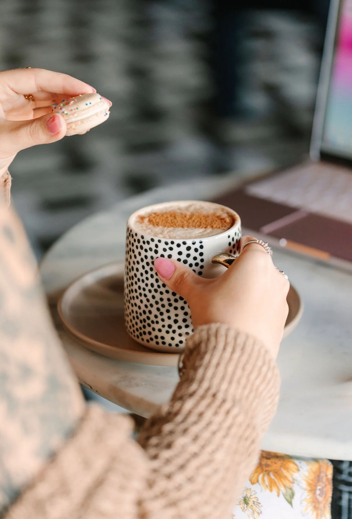 Coffee with a macaron in a cozy café setting