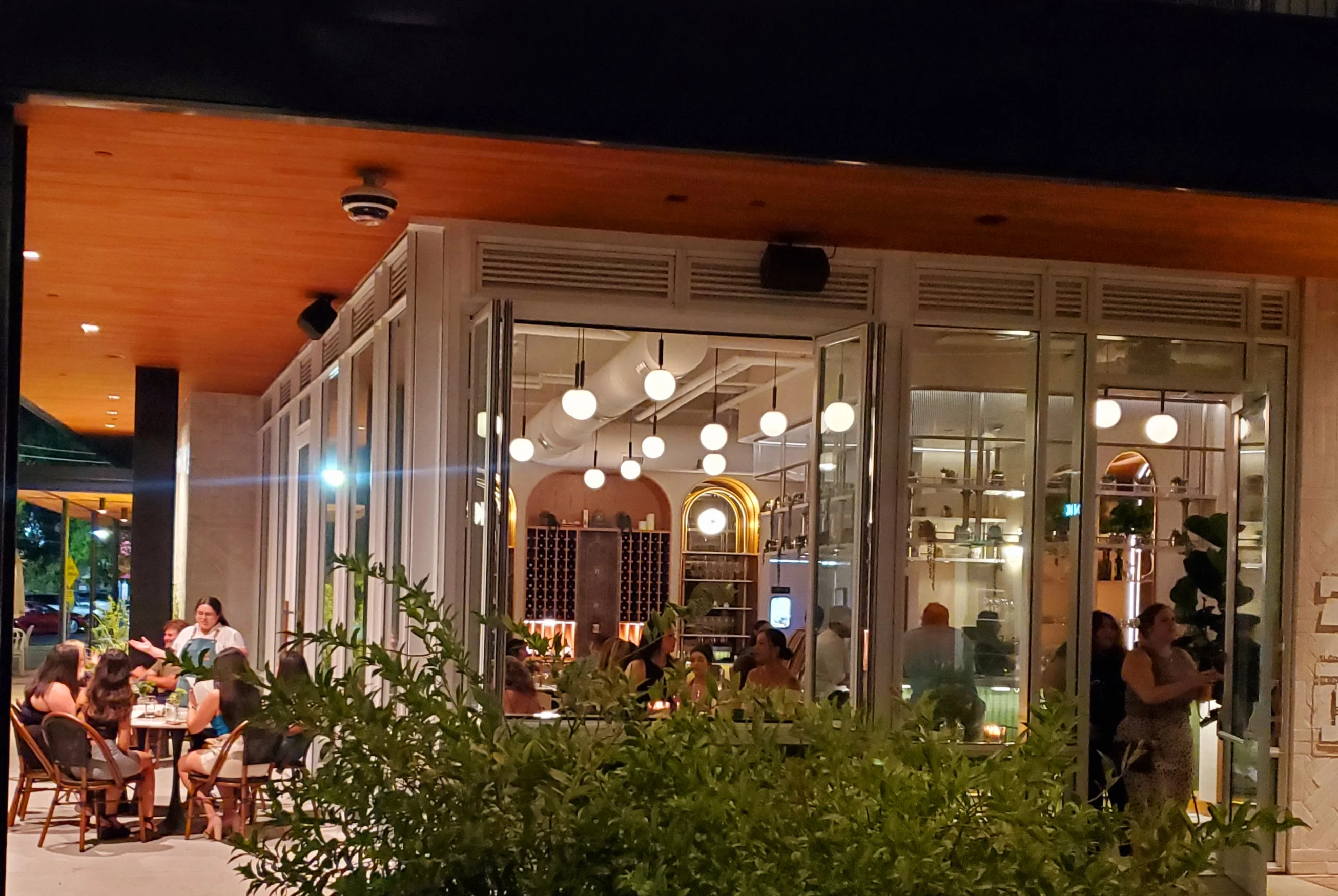 Charming restaurant exterior with outdoor seating and modern decor