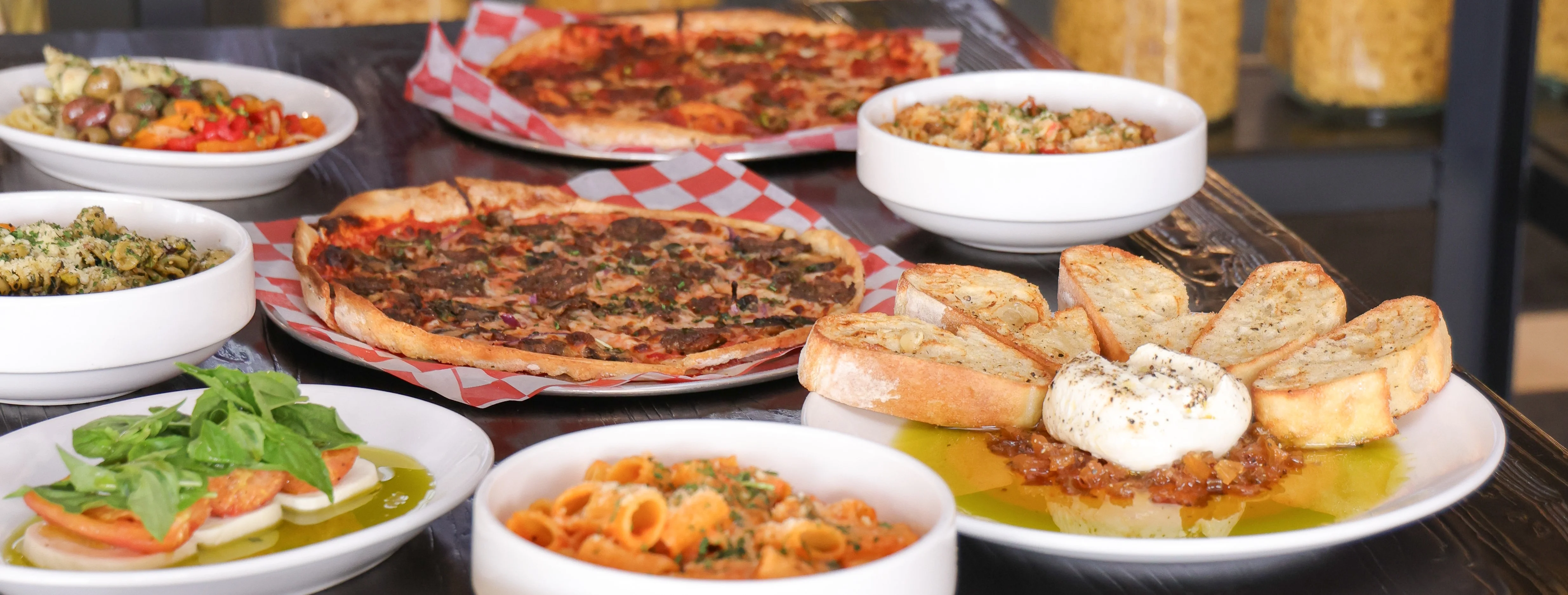 Italian antipasto platter with pizza and pasta dishes