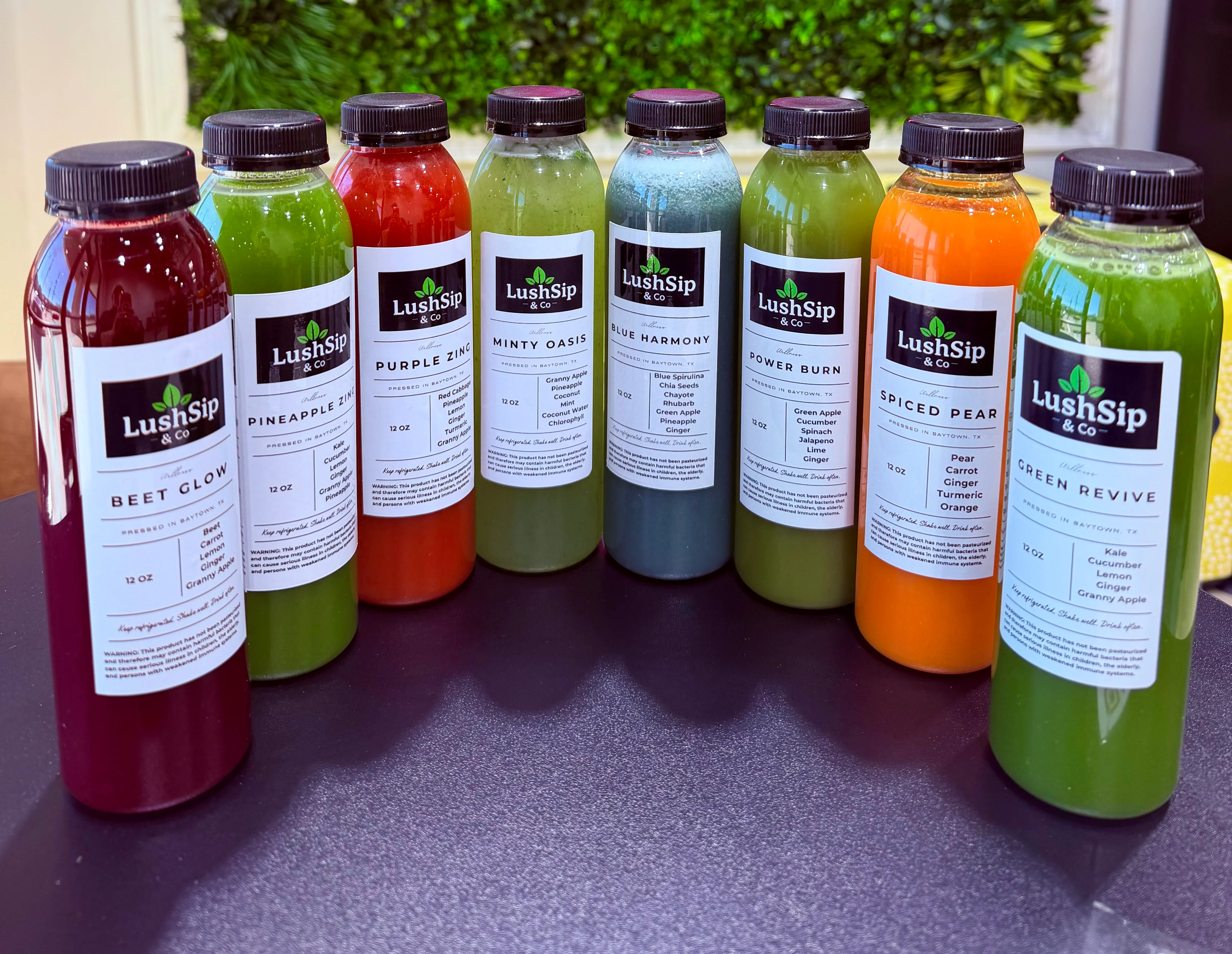Colorful assortment of fresh cold-pressed juices from LushSip & Co.