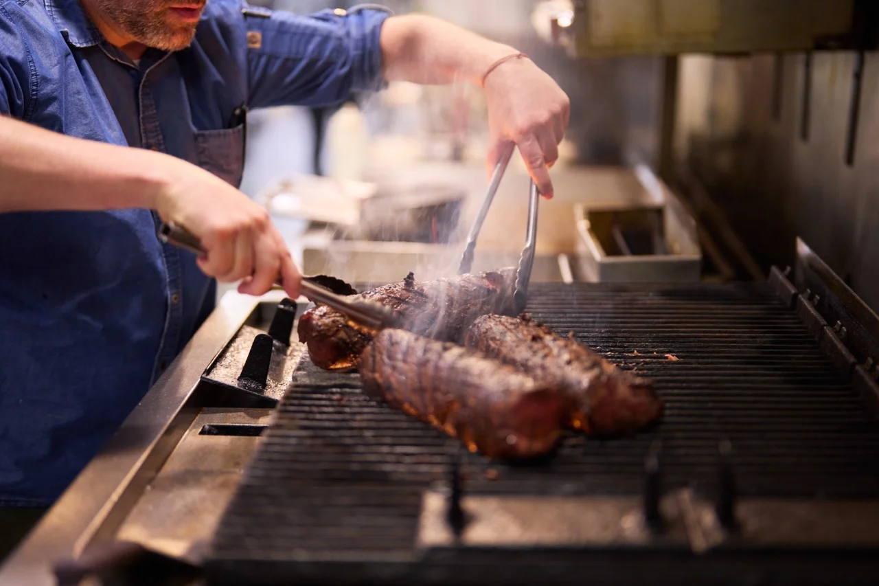 A restaurant chef preparing a dish