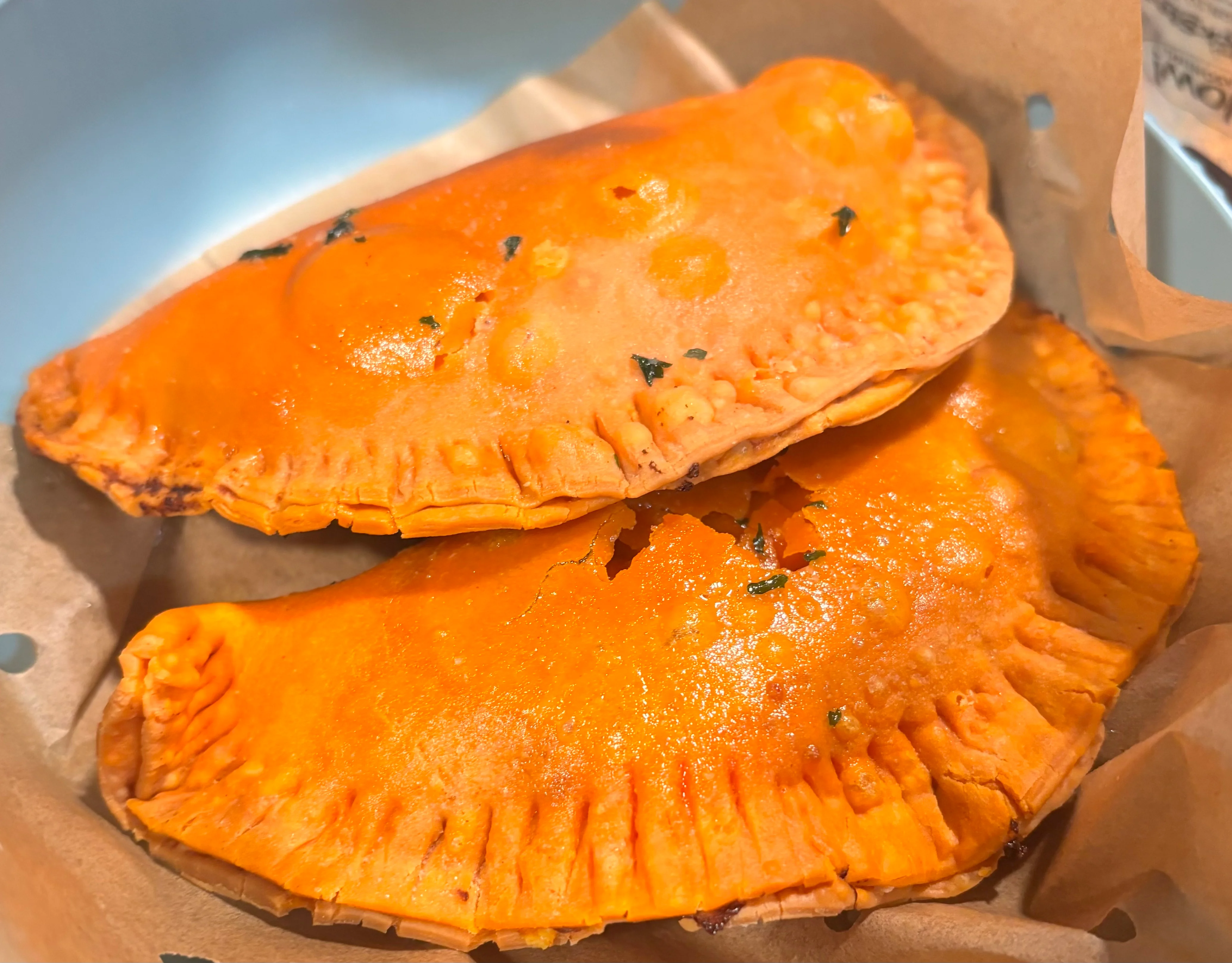 Golden Jamaican patties served in a basket