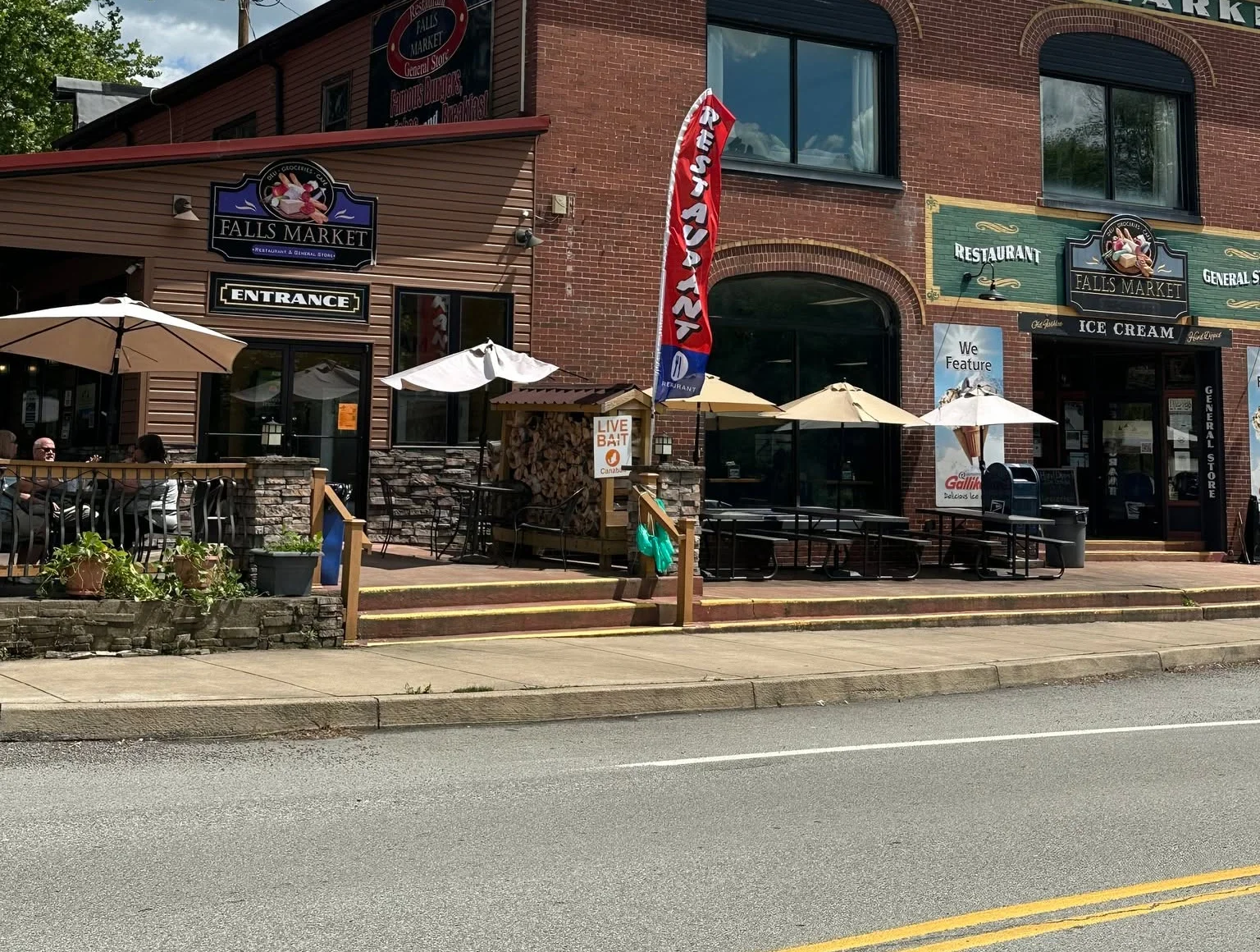 Charming restaurant exterior with outdoor seating and vibrant signage