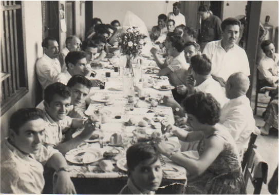 Gathering of friends enjoying a meal at a long dining table